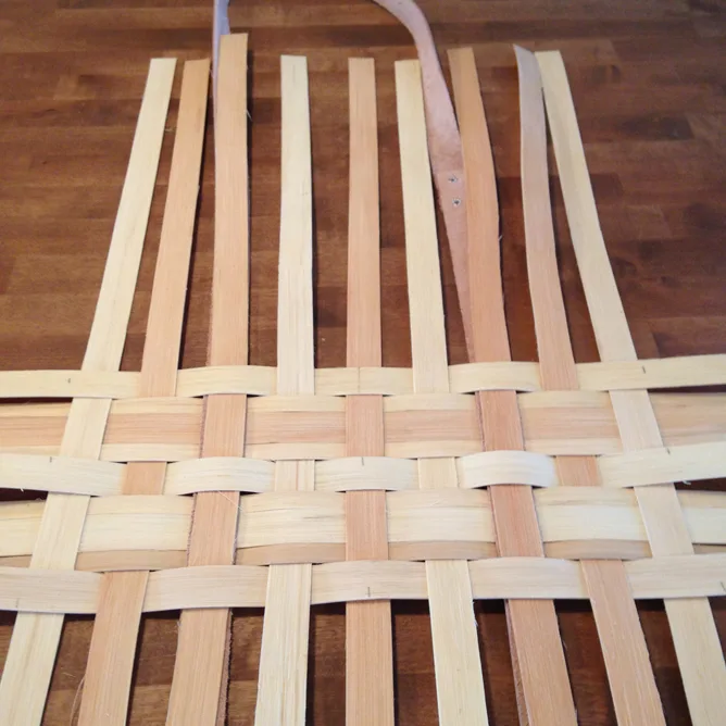 Base with leather strapping